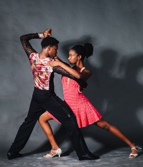 Man and woman in a dancing pose.
